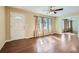 Spacious living room with hardwood floors, large windows, and a view into another room at 1276 Clay Sw Rd, Mableton, GA 30126