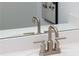 Modern silver bathroom faucet on white sink and white countertop at 1578 Driggs Nw Dr # 171, Atlanta, GA 30318