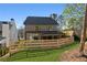 This fenced backyard is ready for entertaining, complete with a covered patio and lush lawn at 262 Green Hill Ne Rd, Sandy Springs, GA 30342
