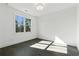 Well-lit bedroom with wood floors, a large window, and fresh white paint at 262 Green Hill Ne Rd, Sandy Springs, GA 30342