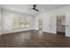 Airy bedroom featuring hardwood floors, ceiling fan, natural light, and closet at 262 Green Hill Ne Rd, Sandy Springs, GA 30342