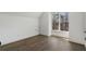 Bright bedroom with large window and hardwood floors at 262 Green Hill Ne Rd, Sandy Springs, GA 30342