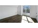 Bright bedroom with large window and hardwood floors at 262 Green Hill Ne Rd, Sandy Springs, GA 30342