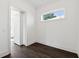 Bright bedroom with white walls, a modern window, and a sliding door at 262 Green Hill Ne Rd, Sandy Springs, GA 30342