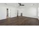 Spacious bedroom with dark wood floors, modern ceiling fan and light walls offers a relaxing retreat at 262 Green Hill Ne Rd, Sandy Springs, GA 30342
