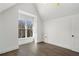 Vaulted ceilings and a large window in this bright bedroom at 262 Green Hill Ne Rd, Sandy Springs, GA 30342