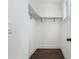 Walk-in closet with dark hardwood floors and adjustable shelving at 262 Green Hill Ne Rd, Sandy Springs, GA 30342