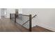 Second floor hallway with wood floors and black metal railing at 262 Green Hill Ne Rd, Sandy Springs, GA 30342