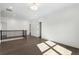 Bright hallway featuring hardwood floors, recessed lighting, and a staircase with black railings, perfect for welcoming guests at 262 Green Hill Ne Rd, Sandy Springs, GA 30342