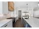 Well-lit kitchen showcasing marble countertops, a stainless steel refrigerator, and an island at 262 Green Hill Ne Rd, Sandy Springs, GA 30342