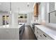 Modern kitchen featuring hardwood floors, an island, white cabinets, and stainless steel appliances at 262 Green Hill Ne Rd, Sandy Springs, GA 30342