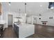 Gourmet kitchen with a large center island, stainless steel appliances, and open living space at 262 Green Hill Ne Rd, Sandy Springs, GA 30342