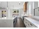Modern kitchen features a center island with countertop seating, stainless steel appliances, and natural light at 262 Green Hill Ne Rd, Sandy Springs, GA 30342