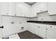 Laundry room with storage, cabinets, sink, and black herringbone tile floors at 262 Green Hill Ne Rd, Sandy Springs, GA 30342
