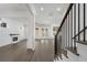 Open concept living room featuring hardwood floors, fireplace, and staircase at 262 Green Hill Ne Rd, Sandy Springs, GA 30342