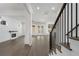 Living room features dark floors, a fireplace, modern lighting, and access to the back yard at 262 Green Hill Ne Rd, Sandy Springs, GA 30342
