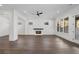 Open-concept living room with hardwood floors, recessed lighting, and a cozy fireplace at 262 Green Hill Ne Rd, Sandy Springs, GA 30342