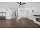 Bright living room featuring hardwood floors, fireplace, and an open layout with stairs at 262 Green Hill Ne Rd, Sandy Springs, GA 30342