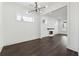 Open-concept living space with dark floors, a fireplace, and modern lighting at 262 Green Hill Ne Rd, Sandy Springs, GA 30342
