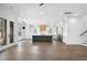 Open-concept living room seamlessly transitions to a gourmet kitchen with high-end appliances at 262 Green Hill Ne Rd, Sandy Springs, GA 30342