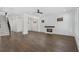 Bright living room featuring hardwood floors, fireplace, and an open layout with stairs at 262 Green Hill Ne Rd, Sandy Springs, GA 30342