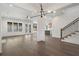 Spacious living room features dark floors, modern lighting, and backyard access at 262 Green Hill Ne Rd, Sandy Springs, GA 30342