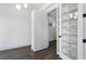 Bright office with dark floors, recessed lighting, and glass paneled shelving unit at 262 Green Hill Ne Rd, Sandy Springs, GA 30342