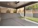 Covered patio with concrete flooring, ceiling fan and adjacent fenced-in landscaped yard at 262 Green Hill Ne Rd, Sandy Springs, GA 30342