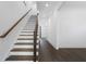 Bright staircase with wood handrail and white risers at 262 Green Hill Ne Rd, Sandy Springs, GA 30342