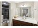 Stylish bathroom with a dark wood vanity, shower with dark tile, and ample counter space at 3870 Wyntuck Nw Ct, Kennesaw, GA 30152