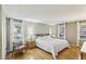 Serene bedroom with hardwood floors, soft natural light, and neutral decor for a relaxing atmosphere at 3870 Wyntuck Nw Ct, Kennesaw, GA 30152