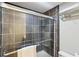 Elegant tiled shower with glass door in the bathroom, showcasing modern design at 3870 Wyntuck Nw Ct, Kennesaw, GA 30152