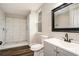 Bathroom featuring walk-in shower, modern vanity, and wood-look flooring at 6219 Heardsville Rd, Cumming, GA 30028