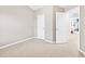 Bedroom with gray walls and access to an adjoining bedroom and closet space at 1262 Park Pass Row, Suwanee, GA 30024