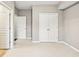 Spacious bedroom showcases neutral tones, plush carpeting, and closet with double doors at 1262 Park Pass Row, Suwanee, GA 30024