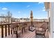 Outdoor deck featuring comfortable wicker seating and an umbrella, perfect for relaxation at 1262 Park Pass Row, Suwanee, GA 30024