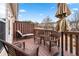 Cozy outdoor deck furnished with wicker chairs and lounge, offering a relaxing space at 1262 Park Pass Row, Suwanee, GA 30024