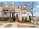 Charming two-story townhome with a well-maintained front yard and inviting entryway at 1262 Park Pass Row, Suwanee, GA 30024