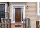 Elegant front door with sidelights, house numbers, and a welcoming entrance at 1262 Park Pass Row, Suwanee, GA 30024