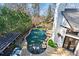 Aerial shot of the pool, patio, outdoor kitchen, and manicured backyard with lush landscaping at 1352 Middlesex Ne Ave, Atlanta, GA 30306