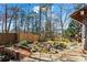 Serene backyard view with a small pond, bridge, and lush landscaping, ideal for relaxation at 1352 Middlesex Ne Ave, Atlanta, GA 30306