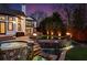 A tiered stone pool features a waterfall and hot tub, nestled in a luxurious, landscaped backyard at 1352 Middlesex Ne Ave, Atlanta, GA 30306