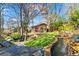 Lush backyard with a stream, a bridge, and a cabin, perfect for outdoor enjoyment at 1352 Middlesex Ne Ave, Atlanta, GA 30306