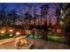 Backyard featuring a pool, spa, fire bowls, and a cabana surrounded by lush landscaping at 1352 Middlesex Ne Ave, Atlanta, GA 30306