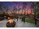 A tranquil deck features a fire bowl and overlooks a pool and manicured grounds and is perfect for entertaining at 1352 Middlesex Ne Ave, Atlanta, GA 30306