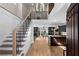 Open-concept living space featuring a staircase, hardwood floors, and abundant natural light at 1352 Middlesex Ne Ave, Atlanta, GA 30306