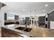 Bright open living area showcasing a kitchen island with a sink, bar area, and backyard views at 1352 Middlesex Ne Ave, Atlanta, GA 30306