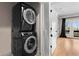 Laundry room featuring modern stacked washer and dryer at 1352 Middlesex Ne Ave, Atlanta, GA 30306