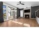 Spacious living room with large windows, a fireplace, and access to the outdoor patio at 1352 Middlesex Ne Ave, Atlanta, GA 30306