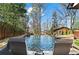 Tranquil pool area with comfortable loungers, lush landscaping, and a relaxing water feature at 1352 Middlesex Ne Ave, Atlanta, GA 30306
